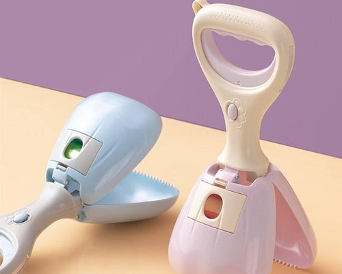 Two pet grooming tools, one blue and one pink, on a two-tone background.